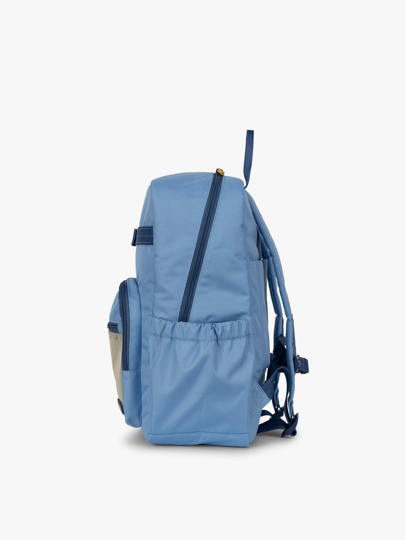CALPAK Kids Medium Backpack in Blue for ages 5-8 side view with water bottle holder pocket