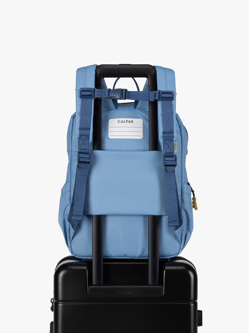 CALPAK Kids Medium Backpack in Blue for ages 5-8 with back luggage trolley sleeve