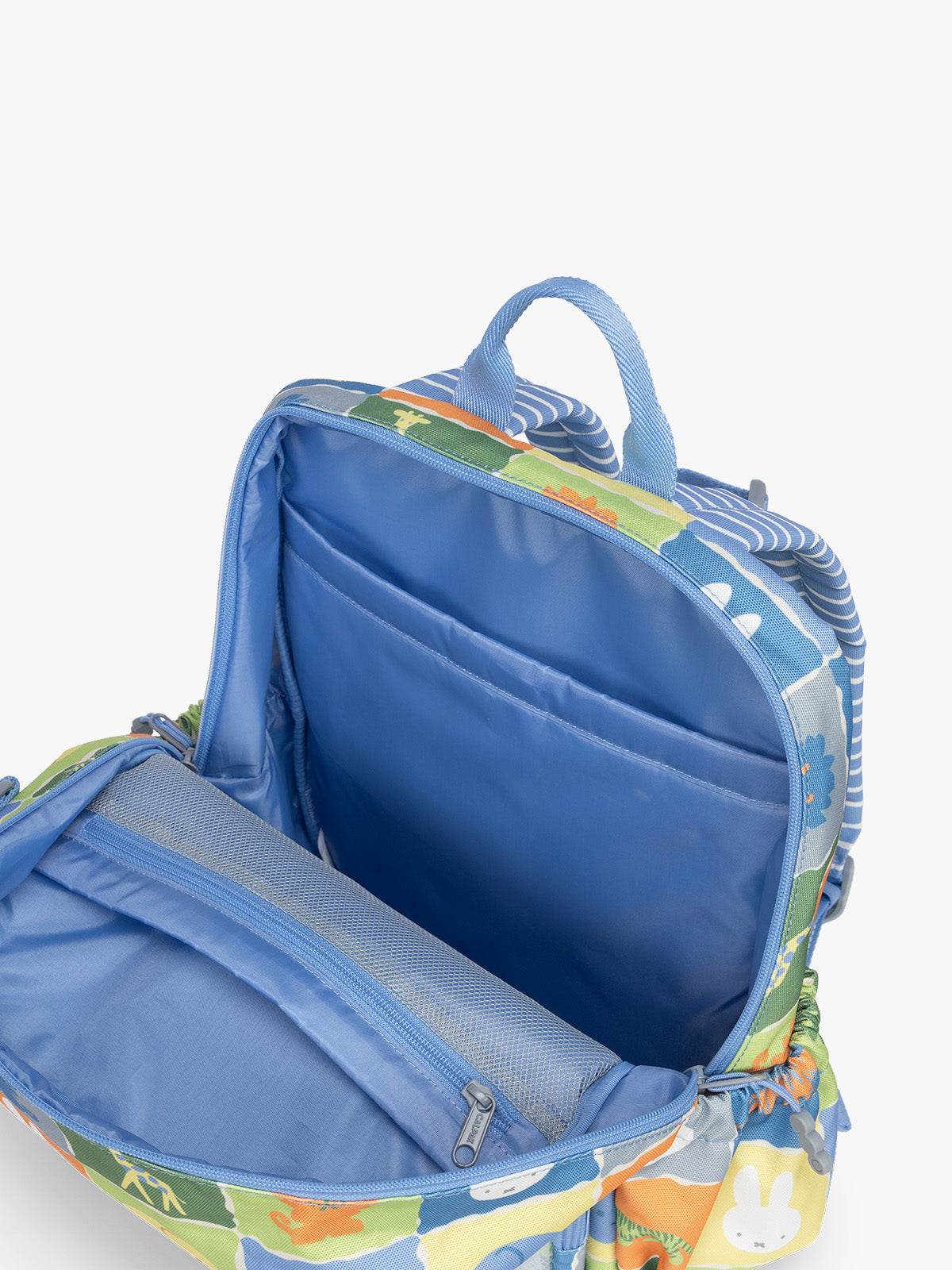 Opened pockets of CALPAK Kids Medium Backpack with Miffy and blue colorful animal pattern on a white background; CKBM2501-MIFFY-BLUE-ZOO-TRIP