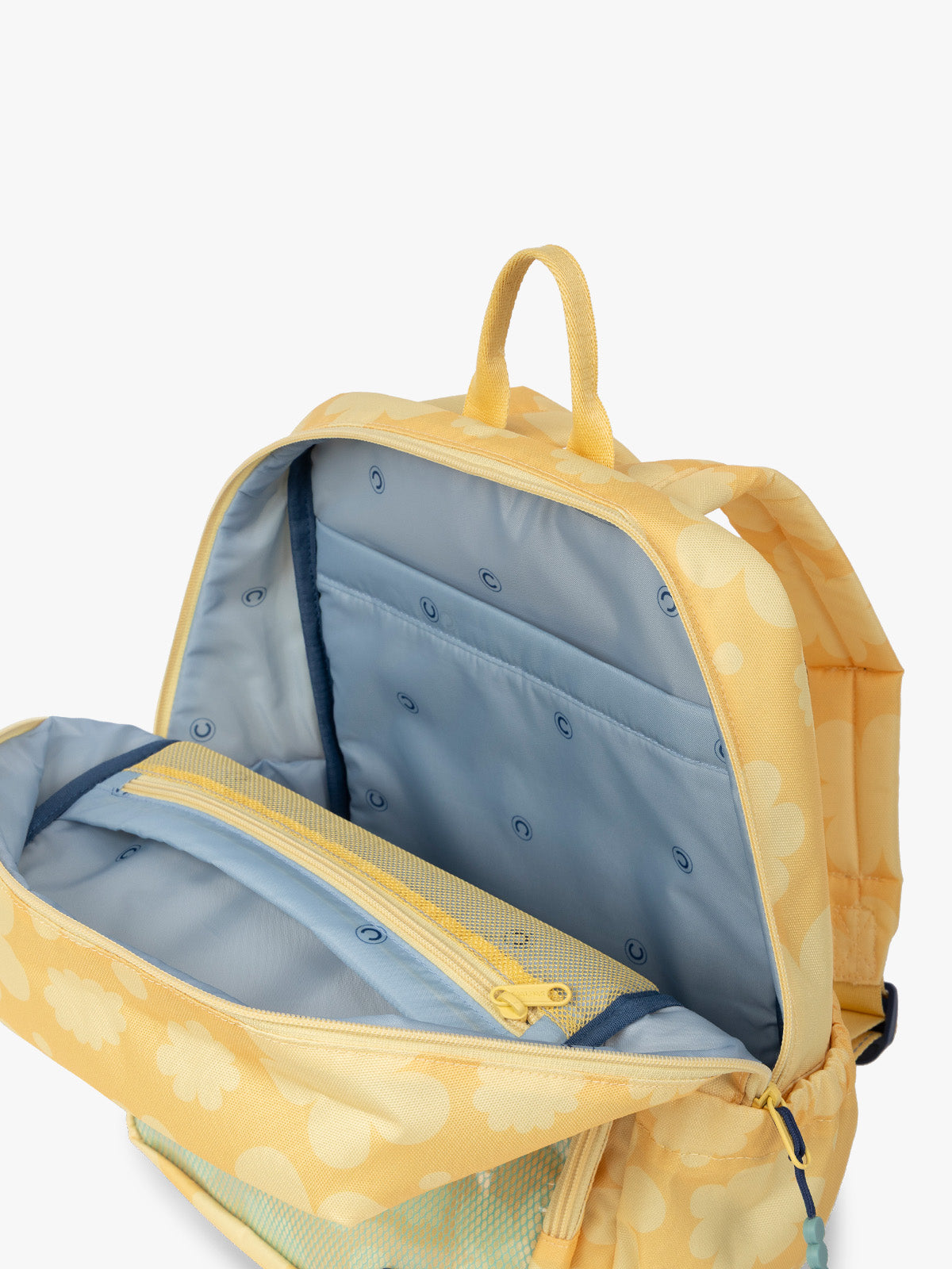 CALPAK Kids Medium Backpack in yellow with tan flower print in Yellow Bloom for ages 5-8 opened view with multiple interior pockets and blue lining; CKBM2501-YELLOW-BLOOM
