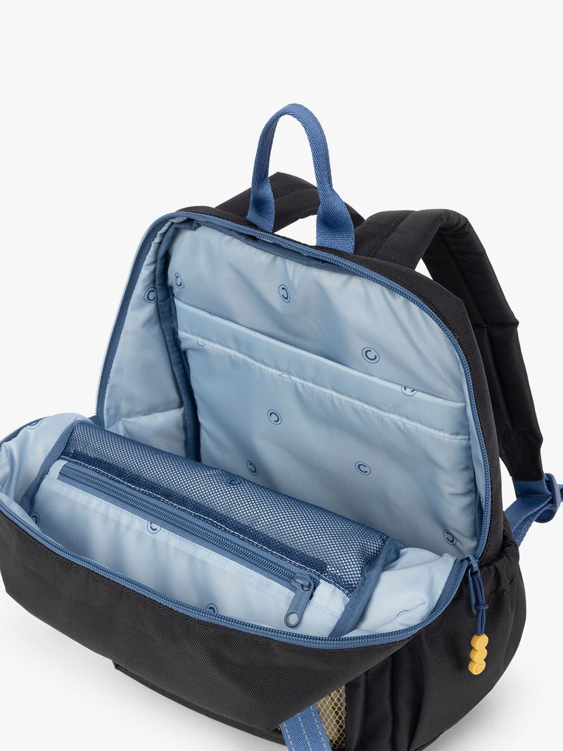 CALPAK Kids Small Backpack in Black for ages 3-5 opened view with multiple interior pockets and blue lining