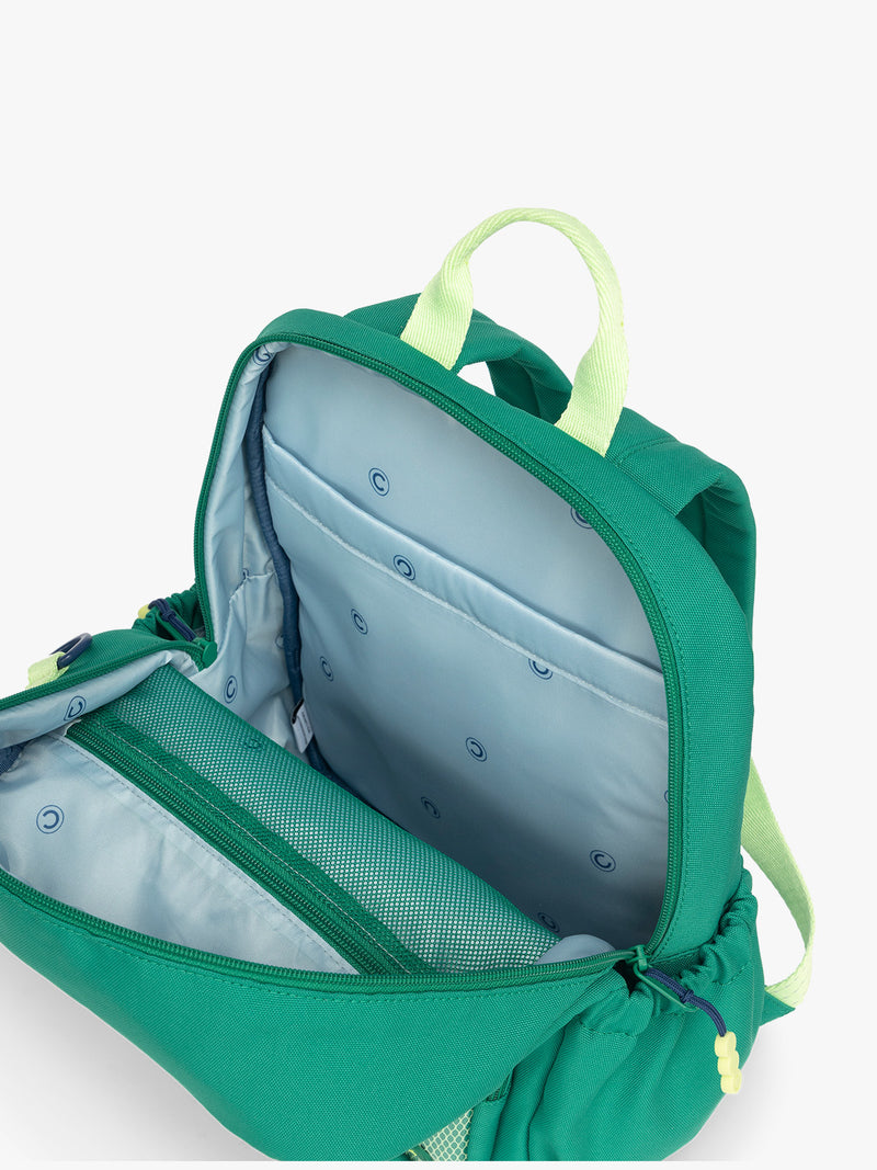 Blue interior opened view of the Green CALPAK Kids Small Backpack with lime green accents on a white background