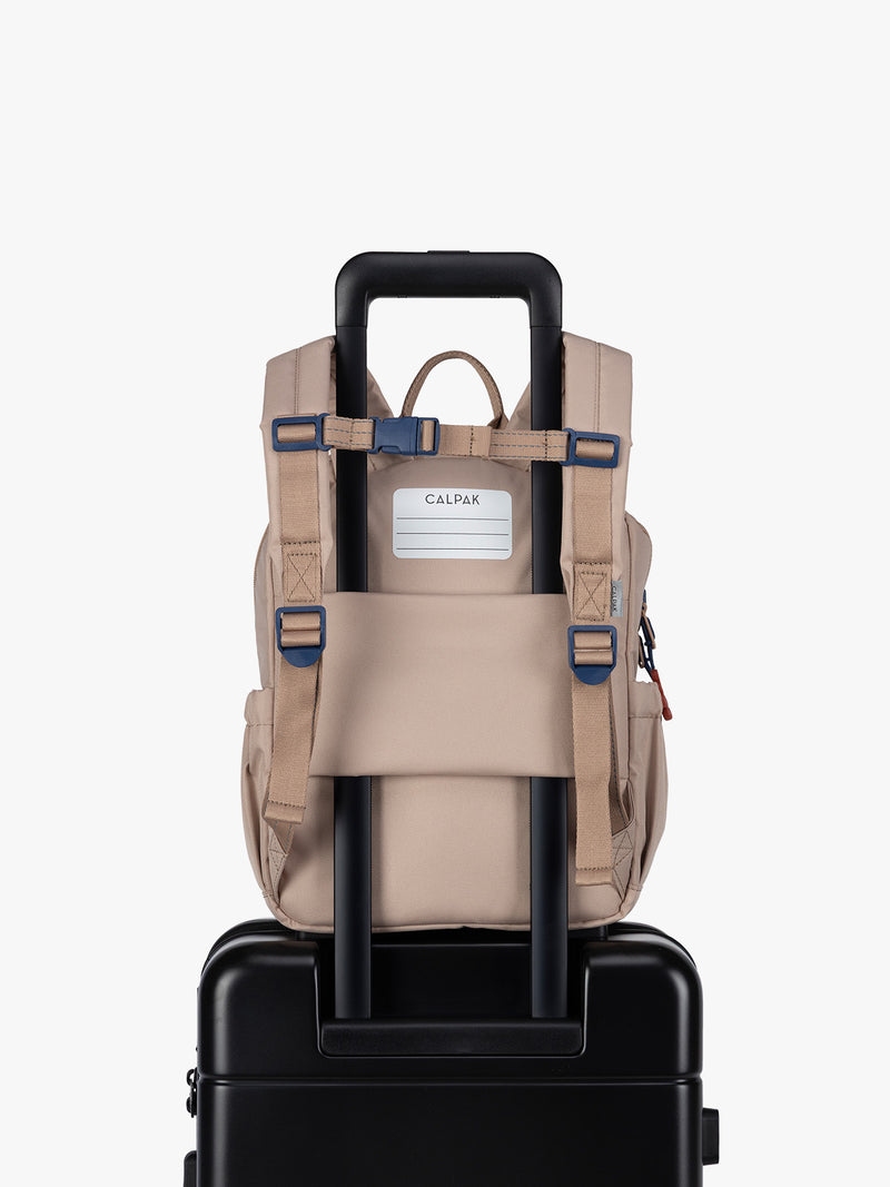 CALPAK Kids Small Backpack in brown and tan Khaki with back luggage trolley sleeve