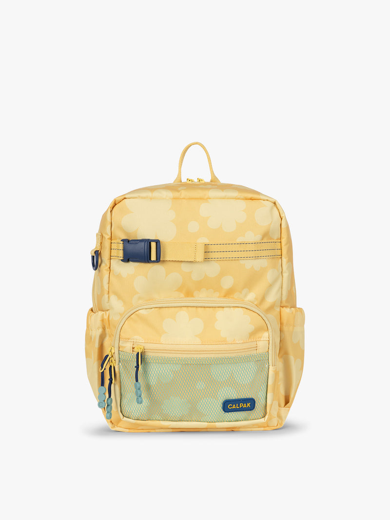 CALPAK Kids Small Backpack in yellow with tan flower print in Yellow Bloom for ages 3-5 is built for your little one’s big days with yellow zippers and blue mesh front pocket, multiple interior pockets for an 11” tablet or laptop, and padded comfort straps