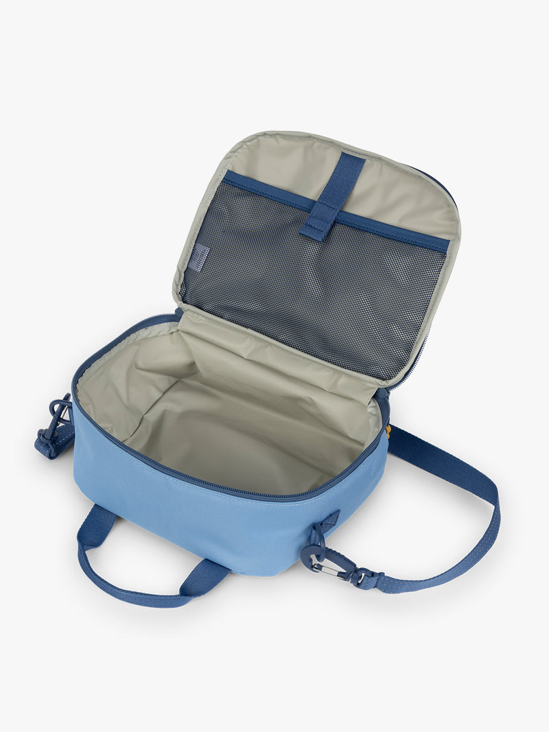 CALPAK Kids Lunch Bag in Blue opened view with water-proof lining, insulated, and mesh pocket