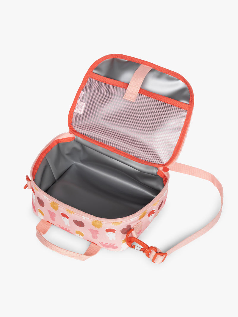 Opened view of insulated feature of the pink CALPAK Kids Lunch Bag with Miffy and animal pattern with mesh front pocket and top handles on a white background