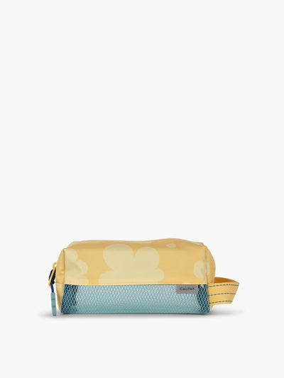 CALPAK Kids Pencil Case in yellow with tan flower print in Yellow Bloom front view with yellow zippers and blue mesh front pocket; CKPC2501-YELLOW-BLOOM view 1