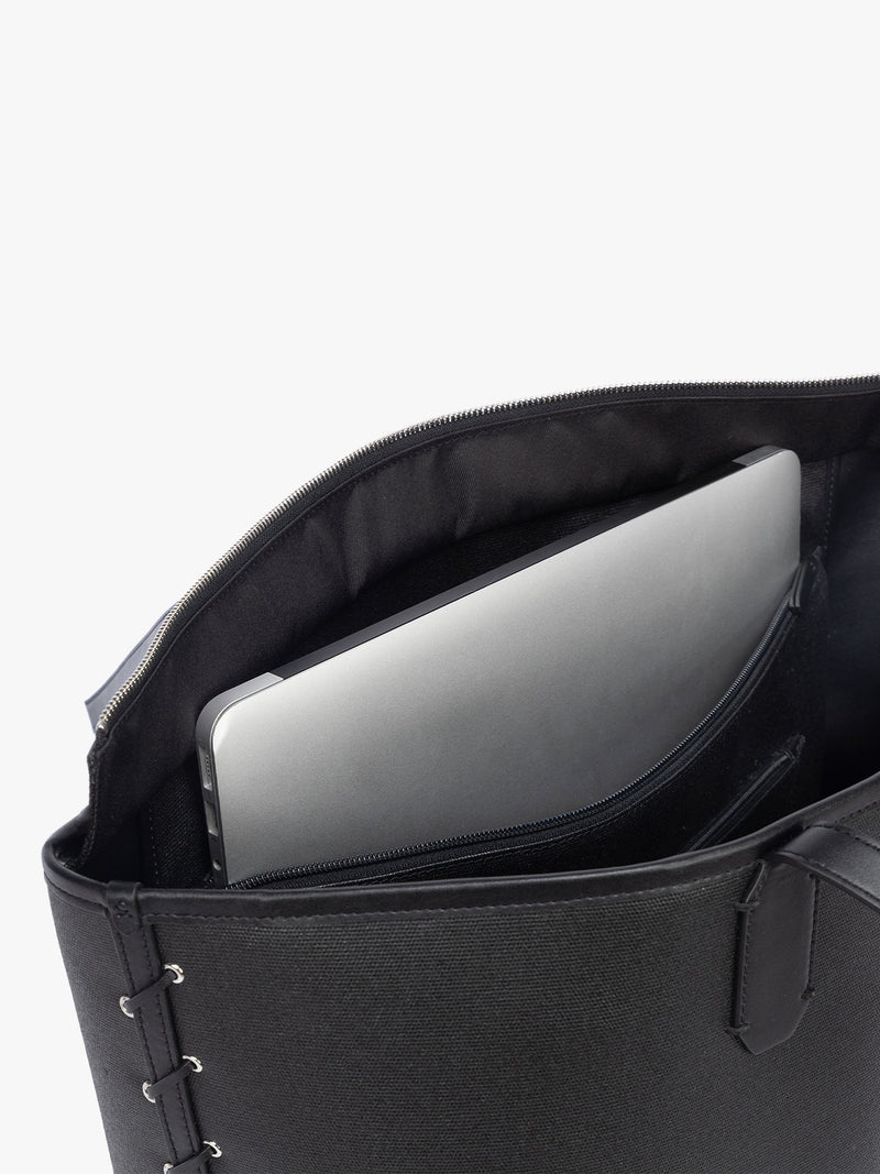Laptop sleeve of CALPAK Colette 15" Canvas Laptop Tote with zipper and interior laptop sleeve in black canvas material