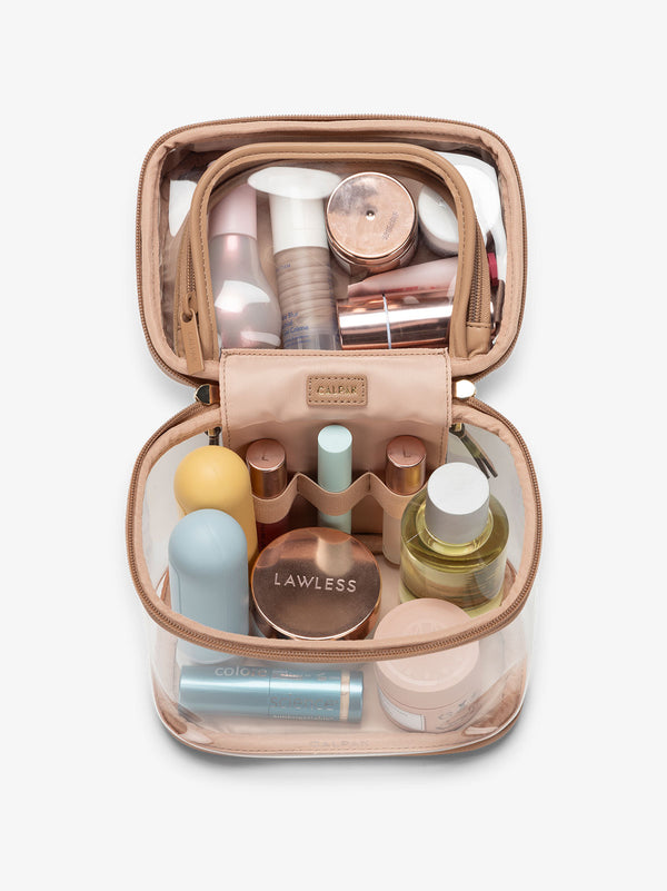 clear train case with top interior pocket for makeup and cosmetics in caramel brown