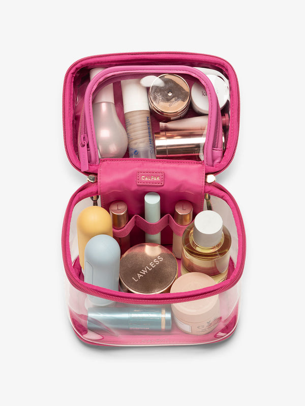 clear train case with top interior pocket for makeup and cosmetics in dragonfruit pink