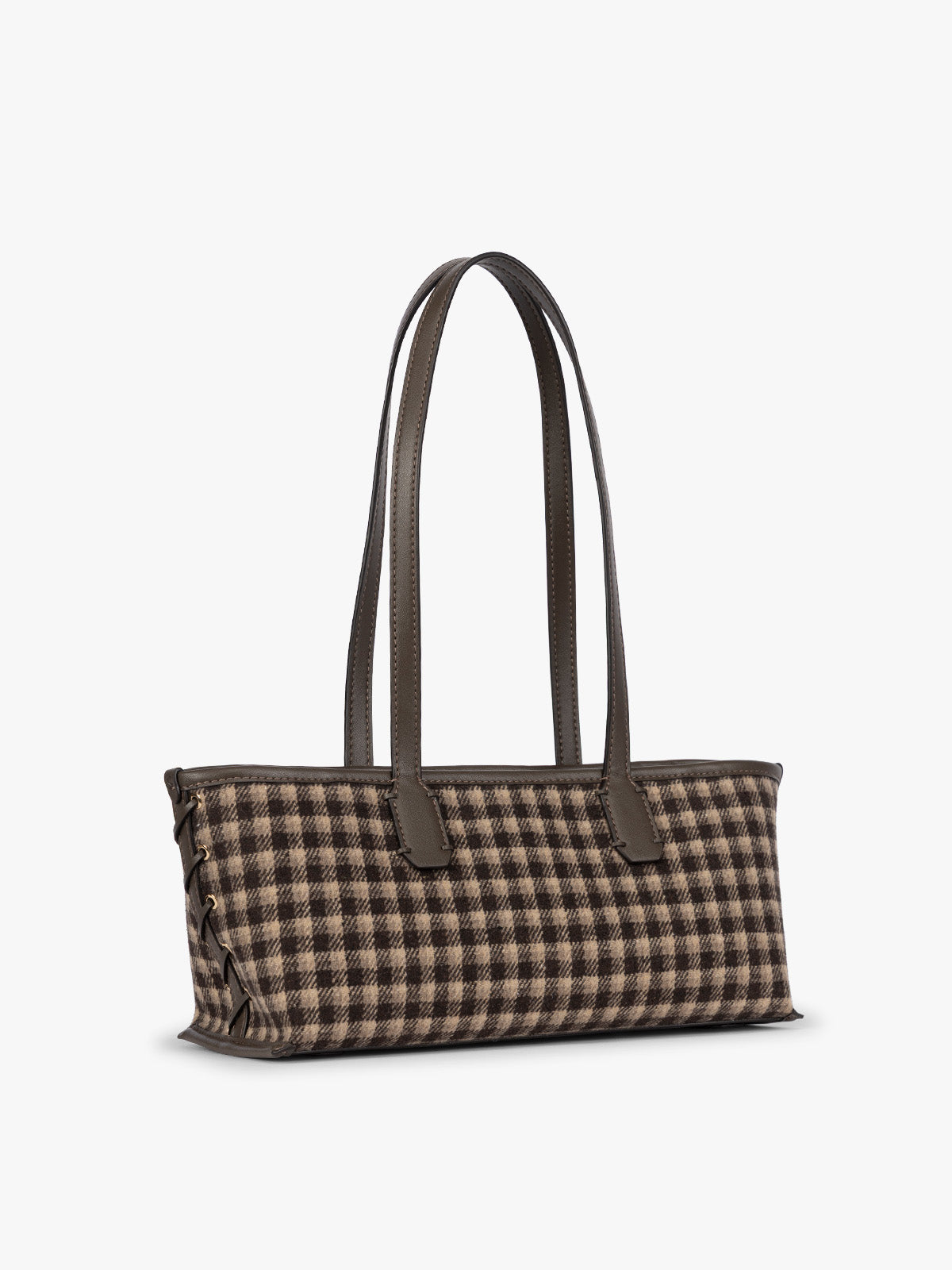 Side view of a structured CALPAK Colette Shoulder Tote in Mushroom Plaid featuring a brown and beige gingham check pattern on the body, with dark brown leather handles and trim, shown against a plain light gray background; CLST2601-MUSHROOM-PLAID