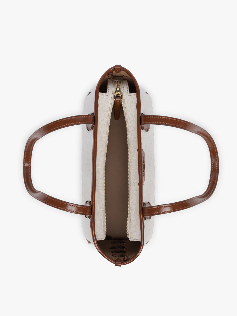 Opened CALPAK Colette Canvas Shoulder Tote in beige canvas material  and brown finishing
