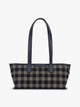 A structured CALPAK Colette Shoulder Tote in Navy Plaid featuring a blue and beige gingham check pattern on the body, with dark brown leather handles and trim, shown against a plain light gray background; CLST2601-NAVY-PLAID
