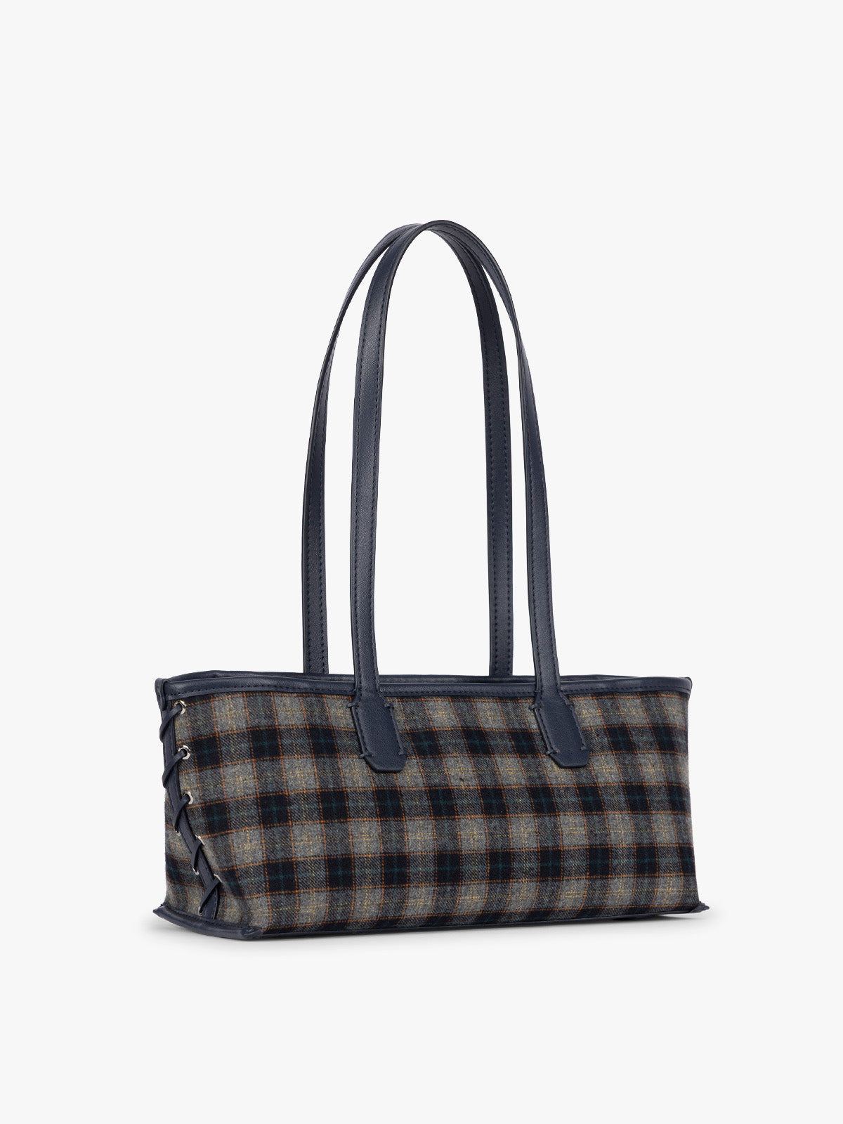 Side view of a structured CALPAK Colette Shoulder Tote in Navy Plaid featuring a blue and beige gingham check pattern on the body, with dark brown leather handles and trim, shown against a plain light gray background; CLST2601-NAVY-PLAID