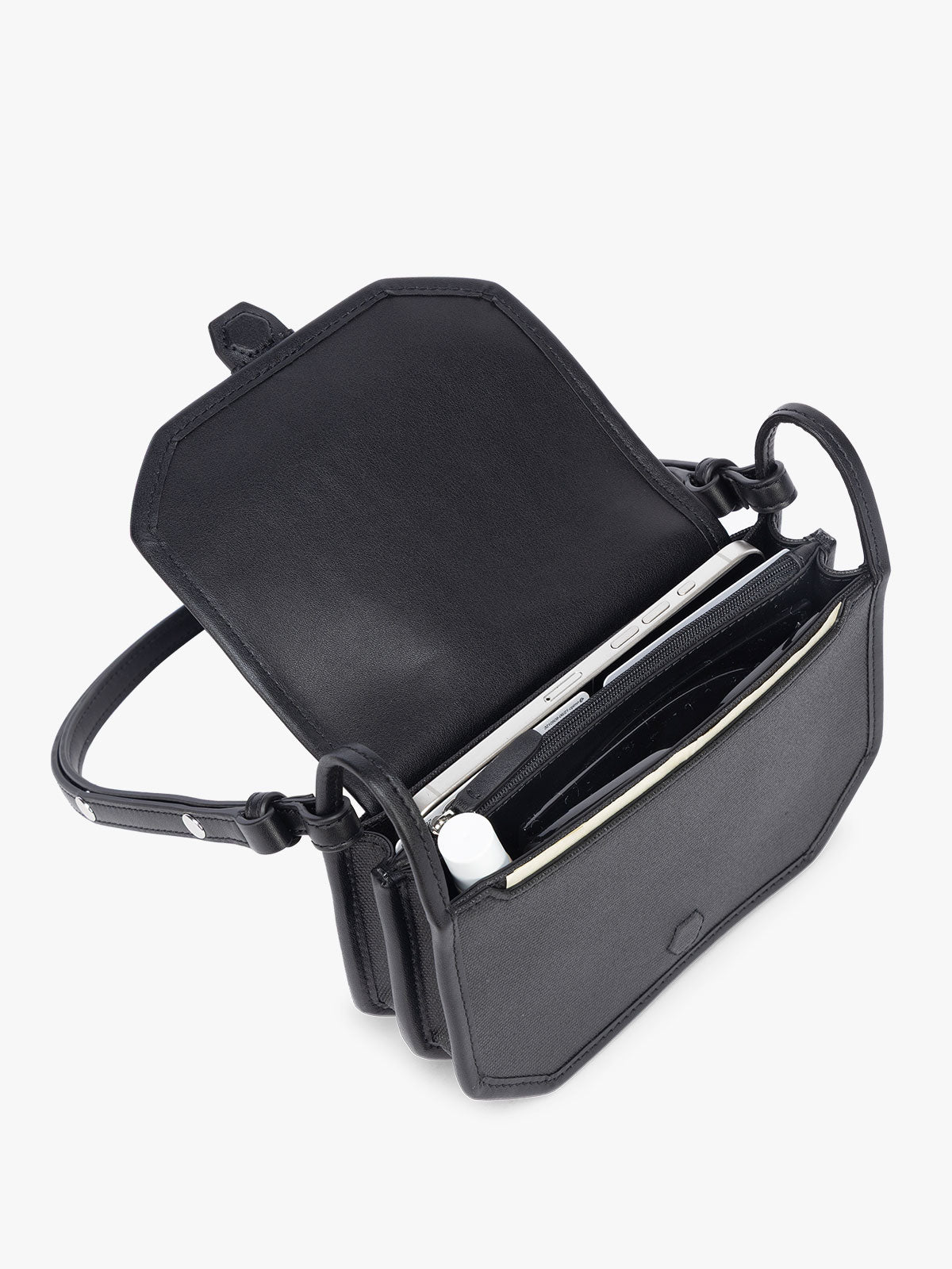 Opened CALPAK Colette Canvas Crossbody Wallet Bag in black canvas material ; CLWC2601-BLACK