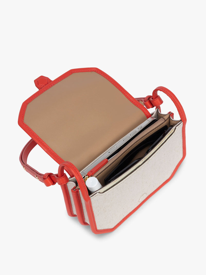 Opened CALPAK Colette Canvas Crossbody Wallet Bag in Natural Brown with beige canvas material and red finishing