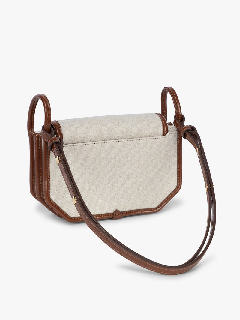 Backside of CALPAK Colette Canvas Crossbody Wallet Bag in Natural Brown with beige canvas material and brown finishing