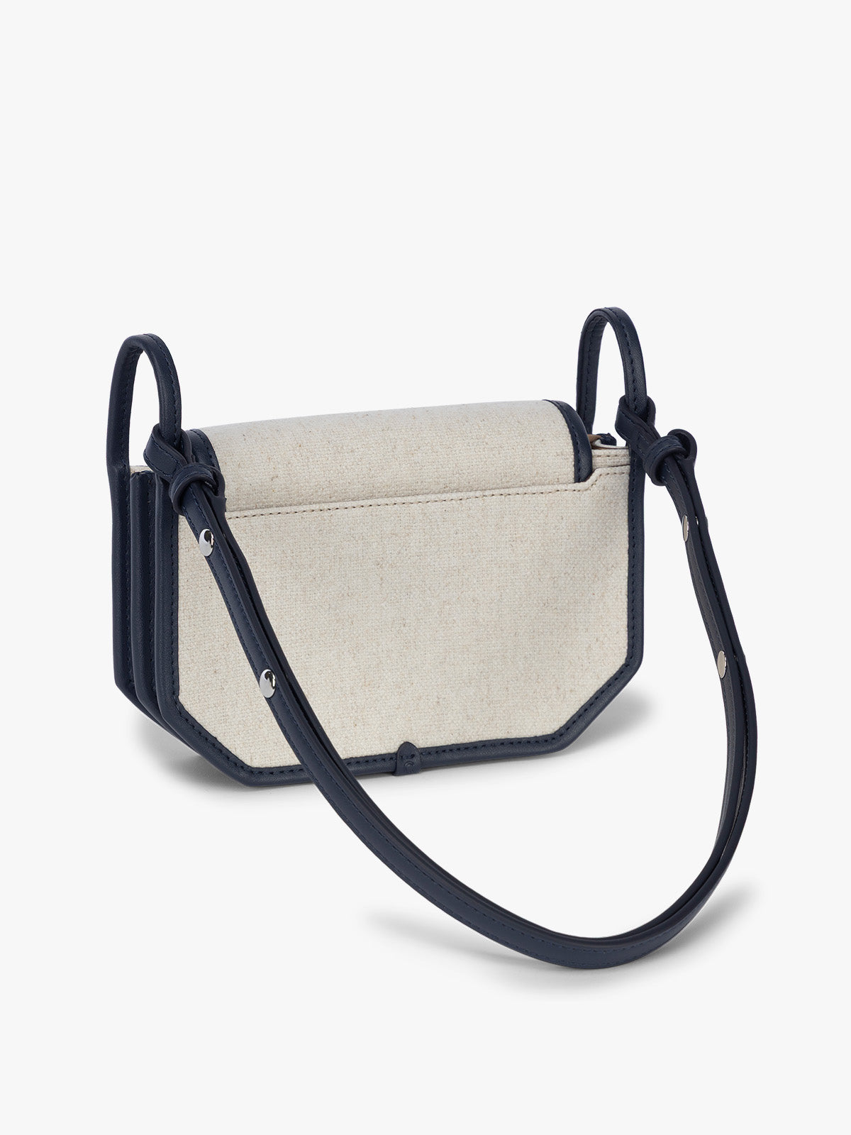 Backside of CALPAK Colette Canvas Crossbody Wallet Bag in Natural Brown with beige canvas material and blue finishing; CLWC2601-NATURAL-NAVY