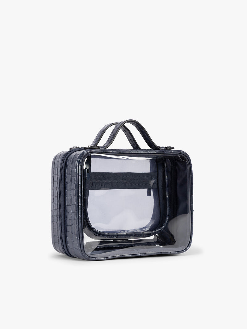 Side view of CALPAK Medium Clear Cosmetics Case that is a transparent pouch with a deep blue Navy in crocodile-embossed
