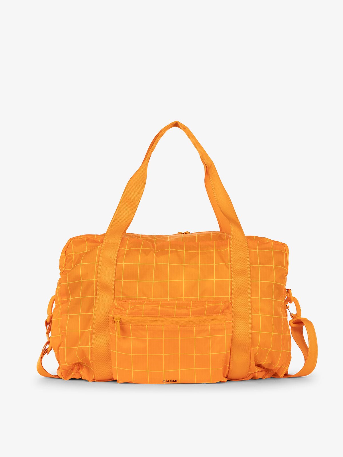 CALPAK Compakt duffel bag with removable crossbody strap and water resistant fabric in orange grid