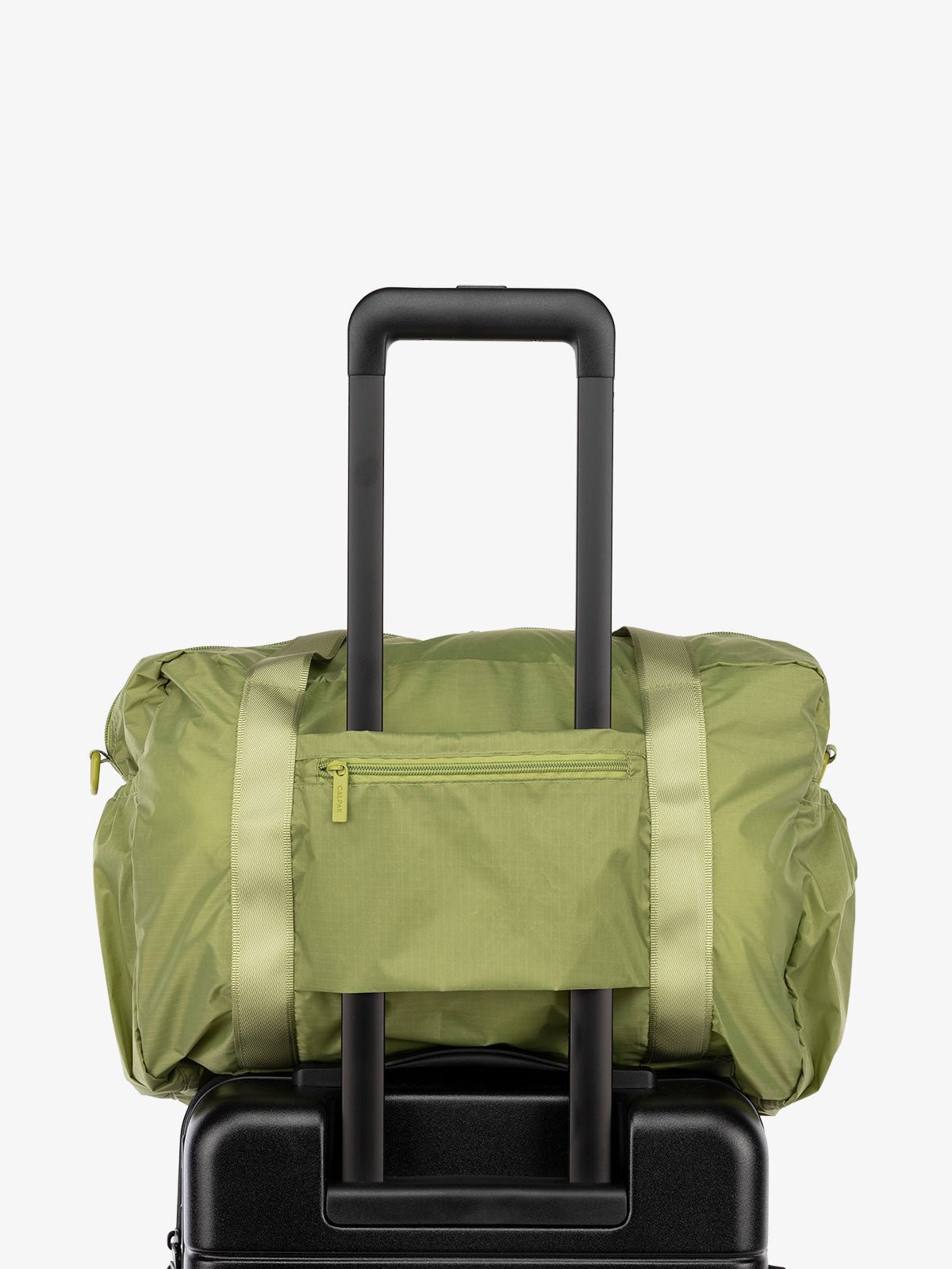 CALPAK Compakt nylon duffle bag with trolley sleeve in green