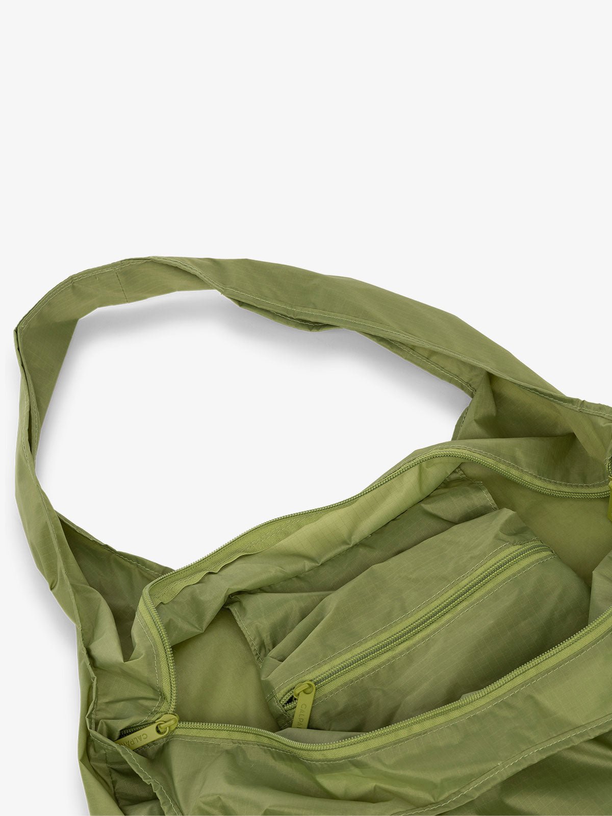 CALPAK Compakt shopping tote bag with interior zipper pocket in palm green
