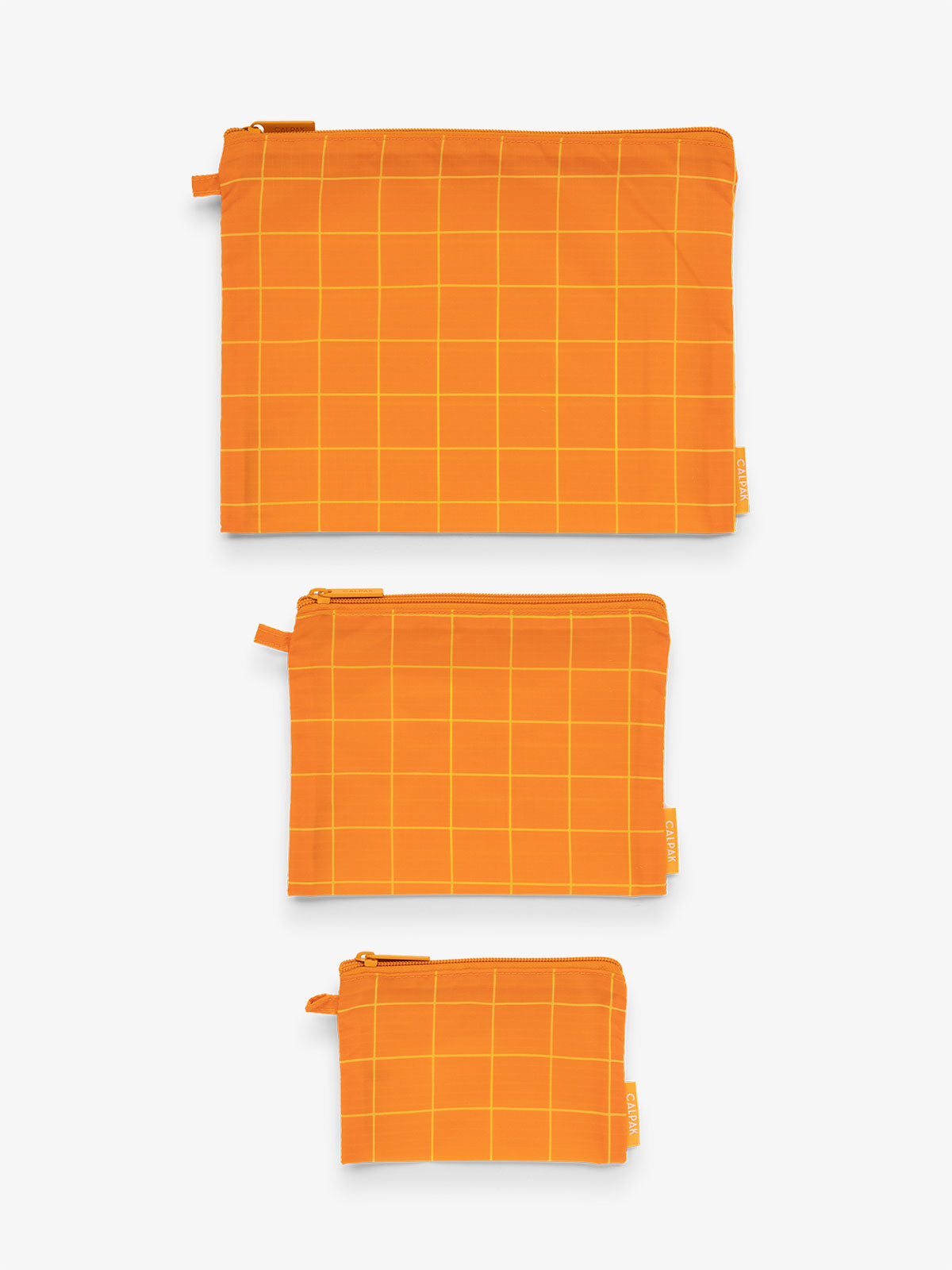 CALPAK Compakt water resistant zippered pouch set for organization in orange grid print; KZB2001-ORANGE-GRID