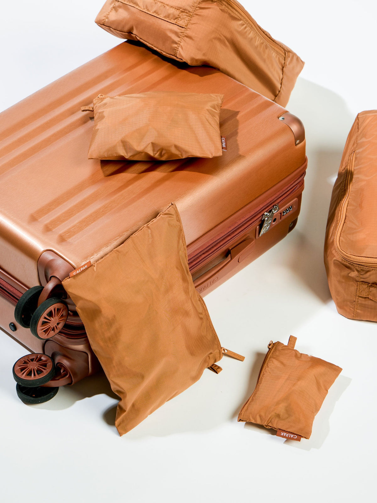 Brown CALPAK Zippered Pouch Set with CALPAK Ambeur Carry-On Luggage and Compakt Shoe Bags; KZB2001-CAMEL