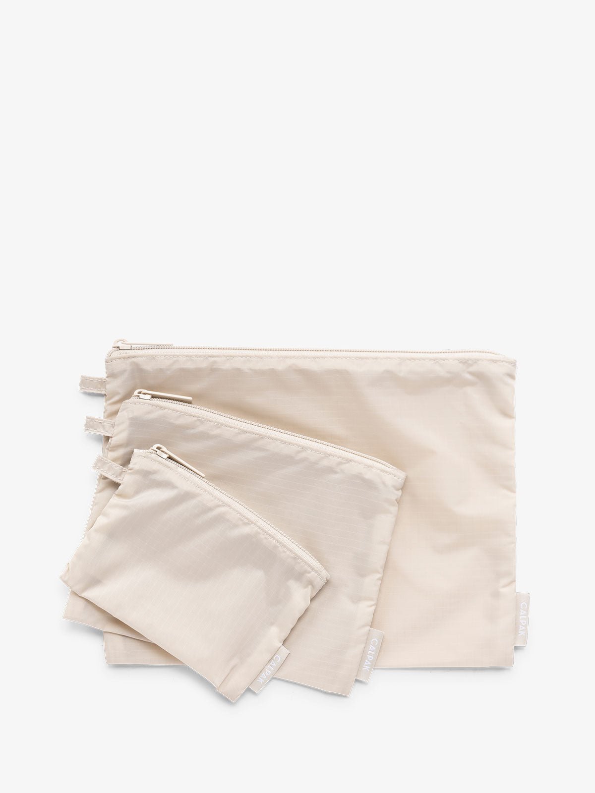 CALPAK Compakt zippered pouches in beige