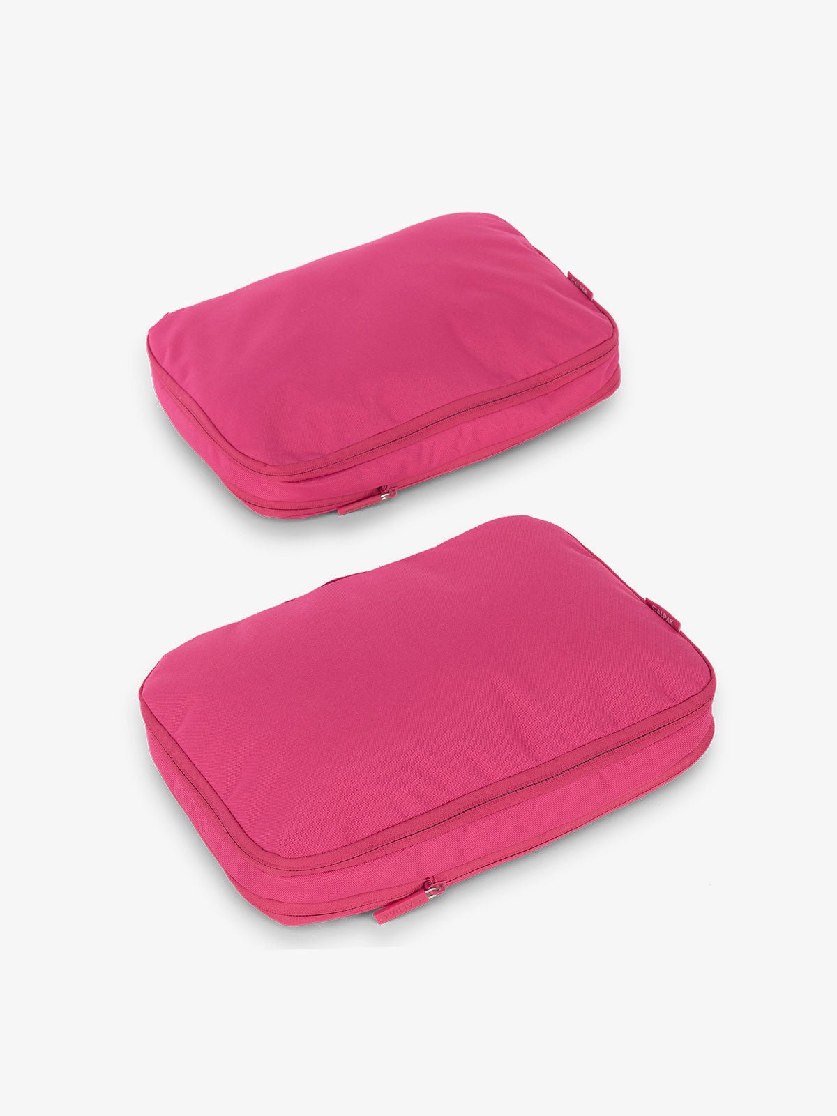 CALPAK compression packing cubes in dragonfruit