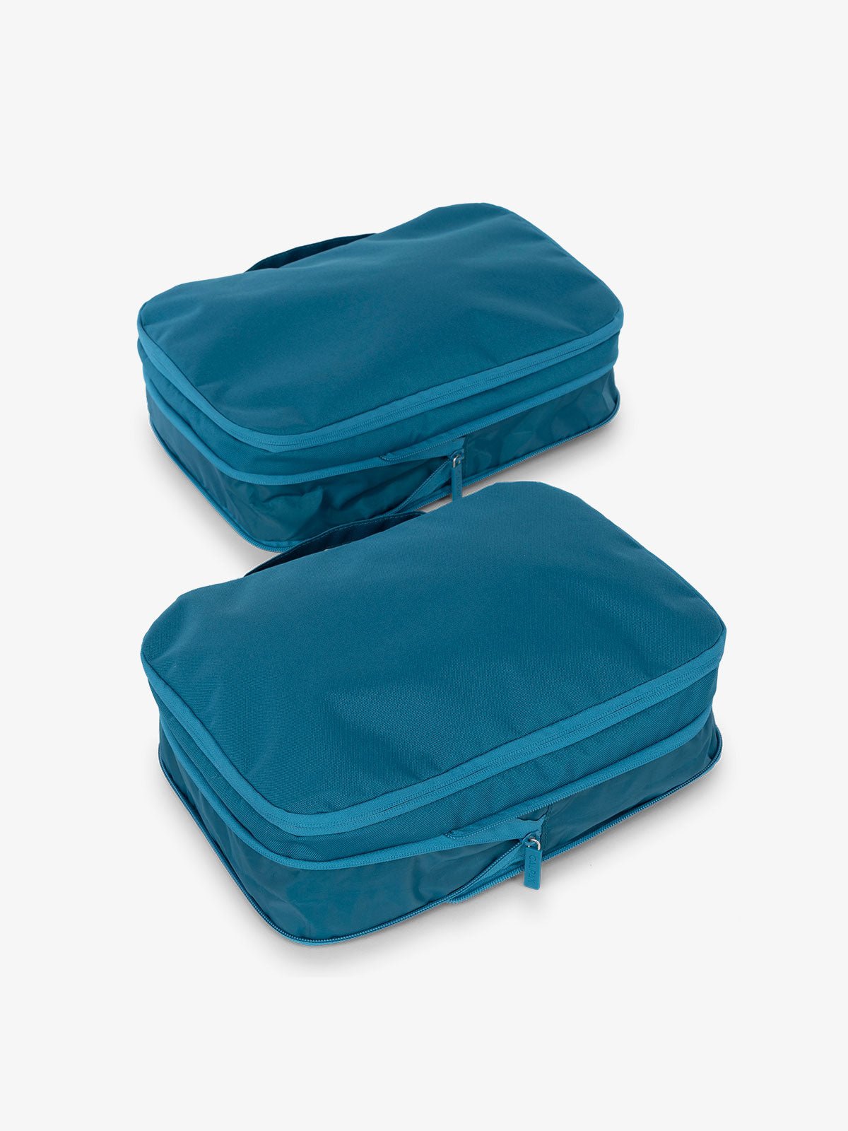 CALPAK compression packing cubes with handles in dark blue