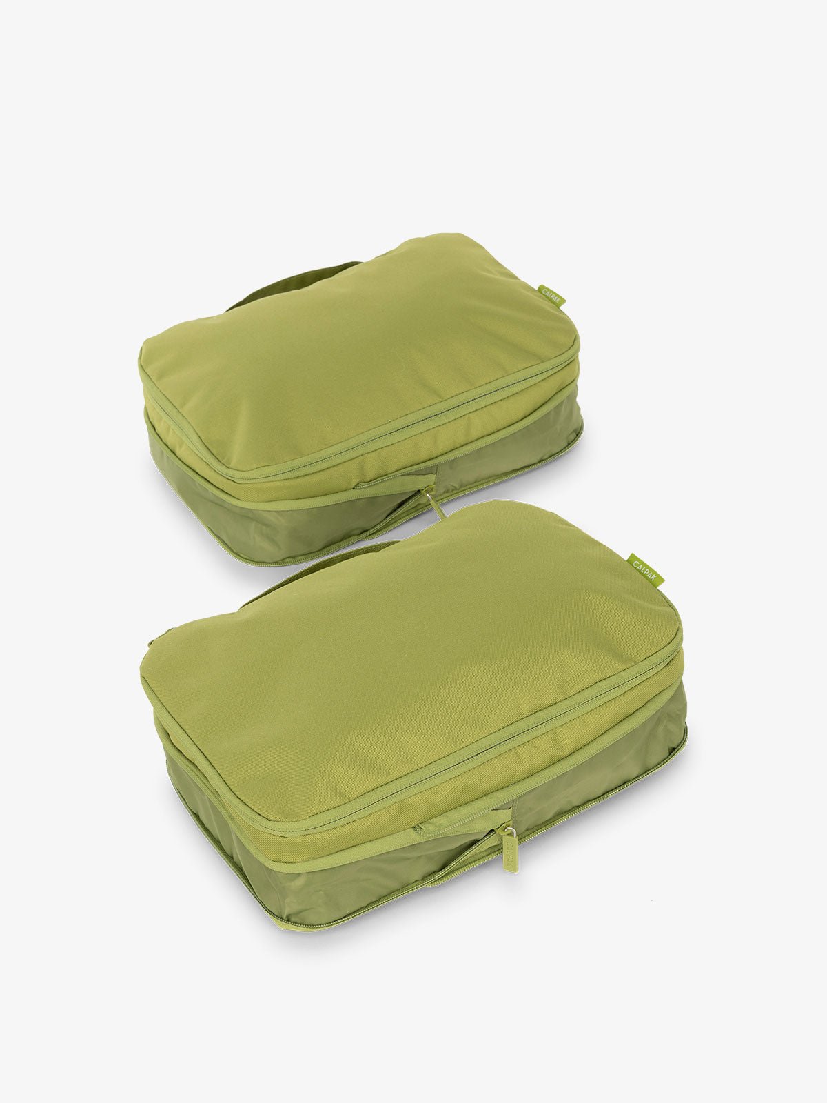 CALPAK compression packing cubes with handles in light green