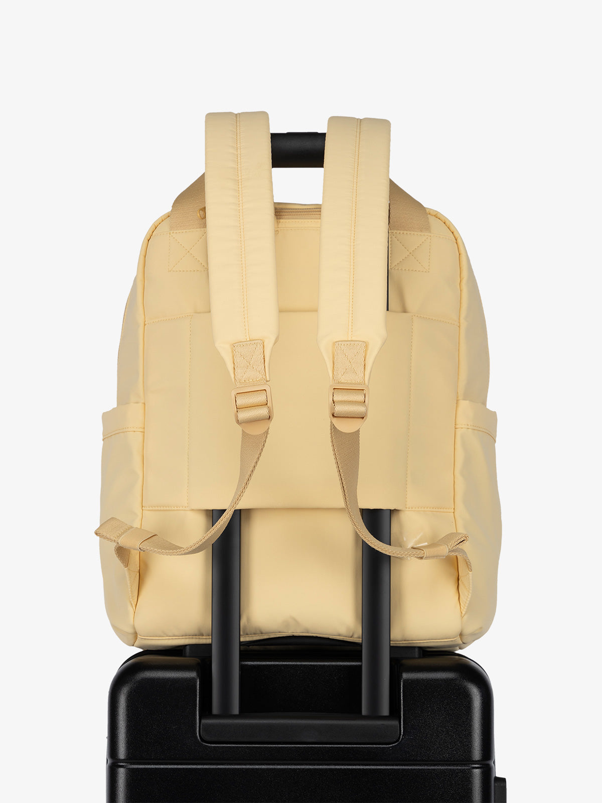 Luggage trolley sleeve of CALPAK Connect Laptop Backpack in sunshine yellow; BCN2401-SUNSHINE