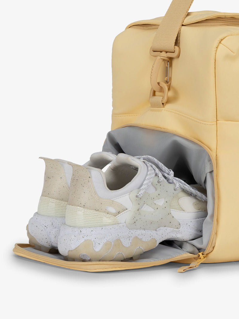 CALPAK Connect laptop duffel bag with separate shoe compartment in sunshine