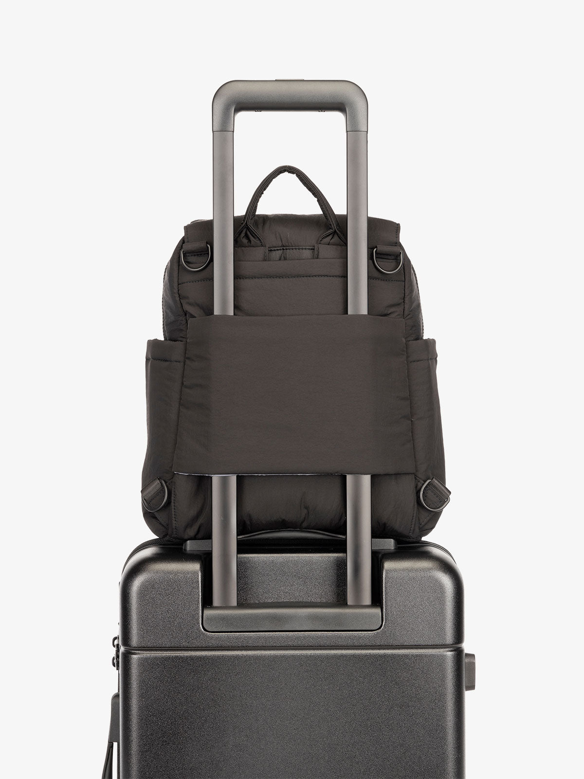 Black CALPAK Convertible Mini Diaper Backpack with luggage trolley sleeve, transport handle, and D-ring attachments; BBPC2401-BLACK, BPC2401-BLACK