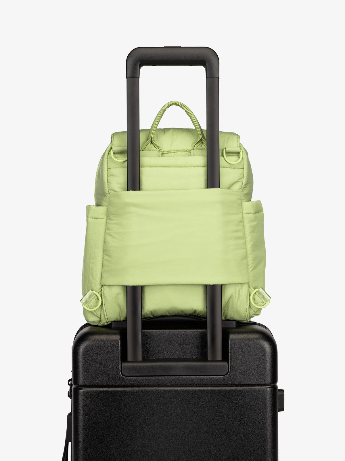 Lime CALPAK Convertible Mini Diaper Backpack with luggage trolley sleeve, transport handle, and D-ring attachments