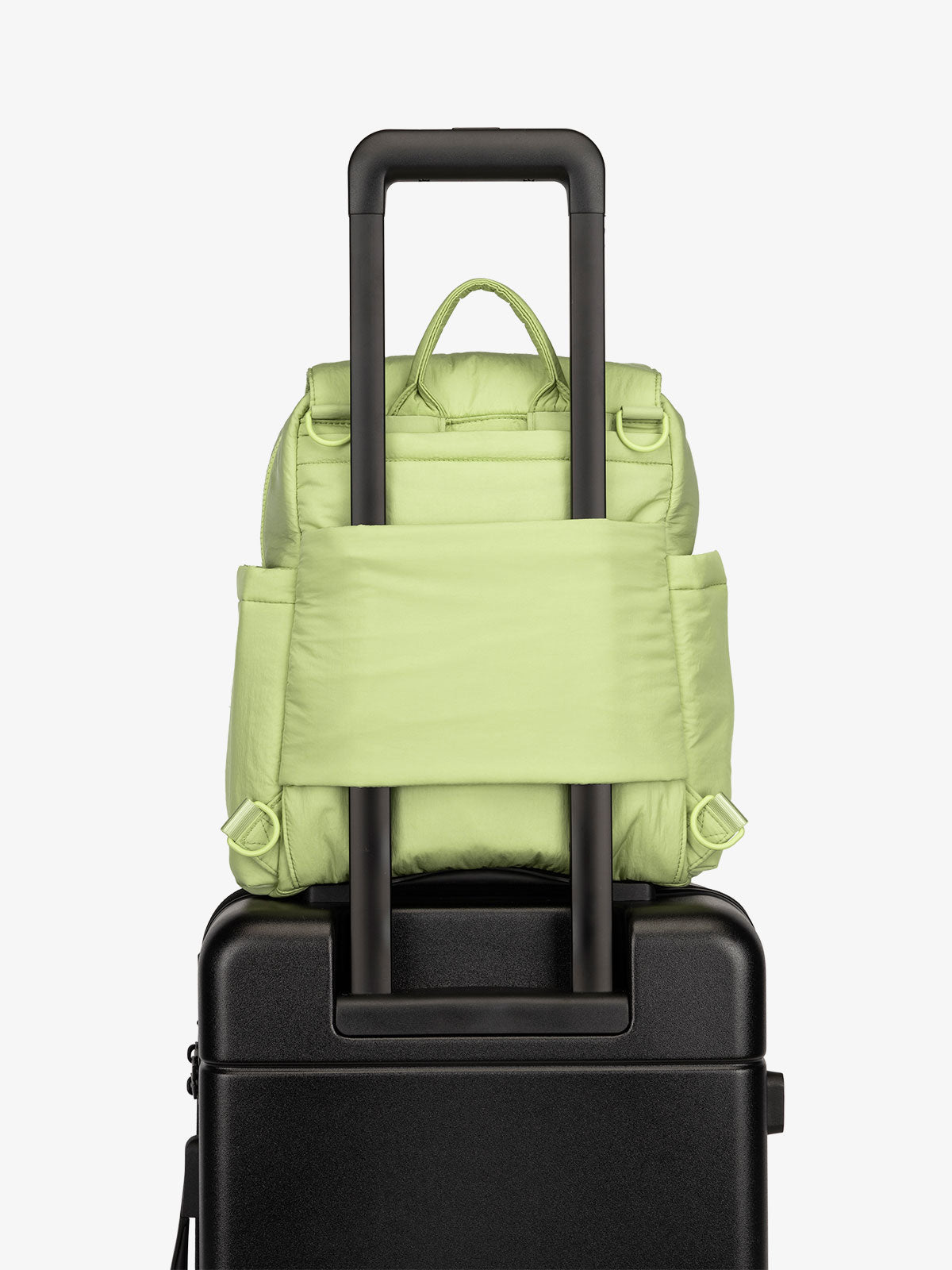 Lime CALPAK Convertible Mini Diaper Backpack with luggage trolley sleeve, transport handle, and D-ring attachments; BPC2401-LIME, BBPC2401-LIME