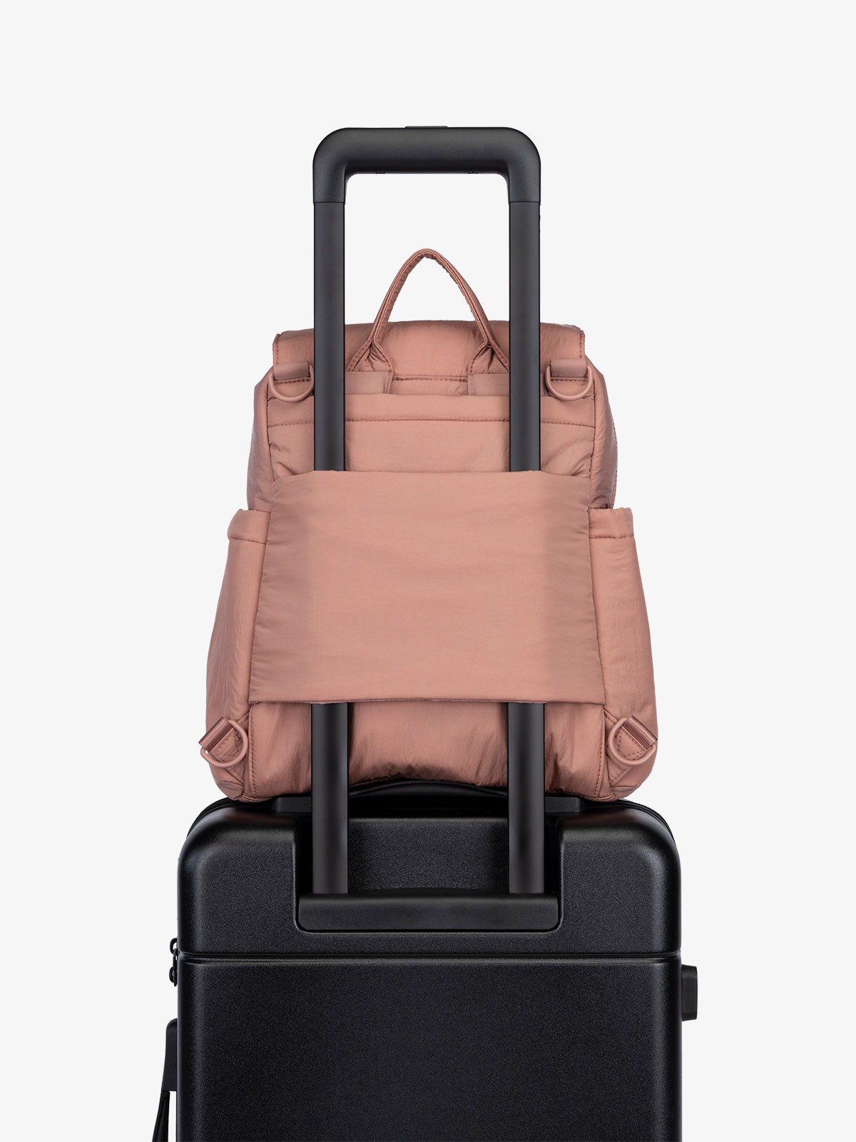 Peony CALPAK Convertible Mini Diaper Backpack with luggage trolley sleeve, transport handle, and D-ring attachments; BPC2401-PEONY, BBPC2401-PEONY