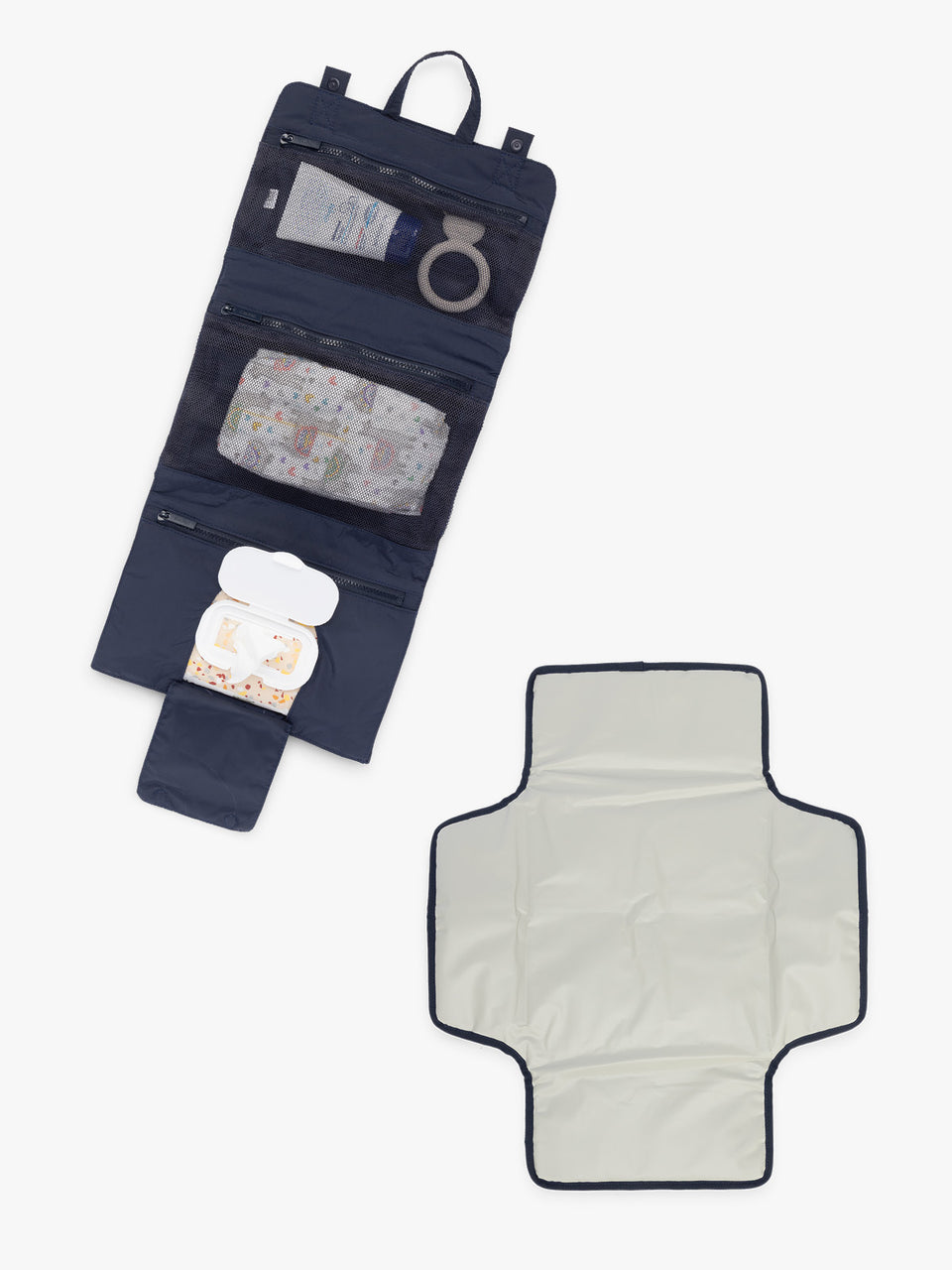 Different compartments of CALPAK Diaper Changing Organizer in blue Navy; CPB2402-NAVY