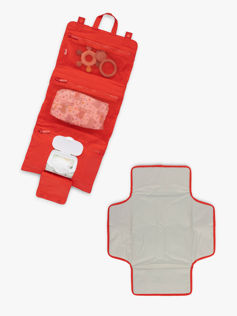 Compartments of CALPAK Diaper Changing Organizer in red Tomato