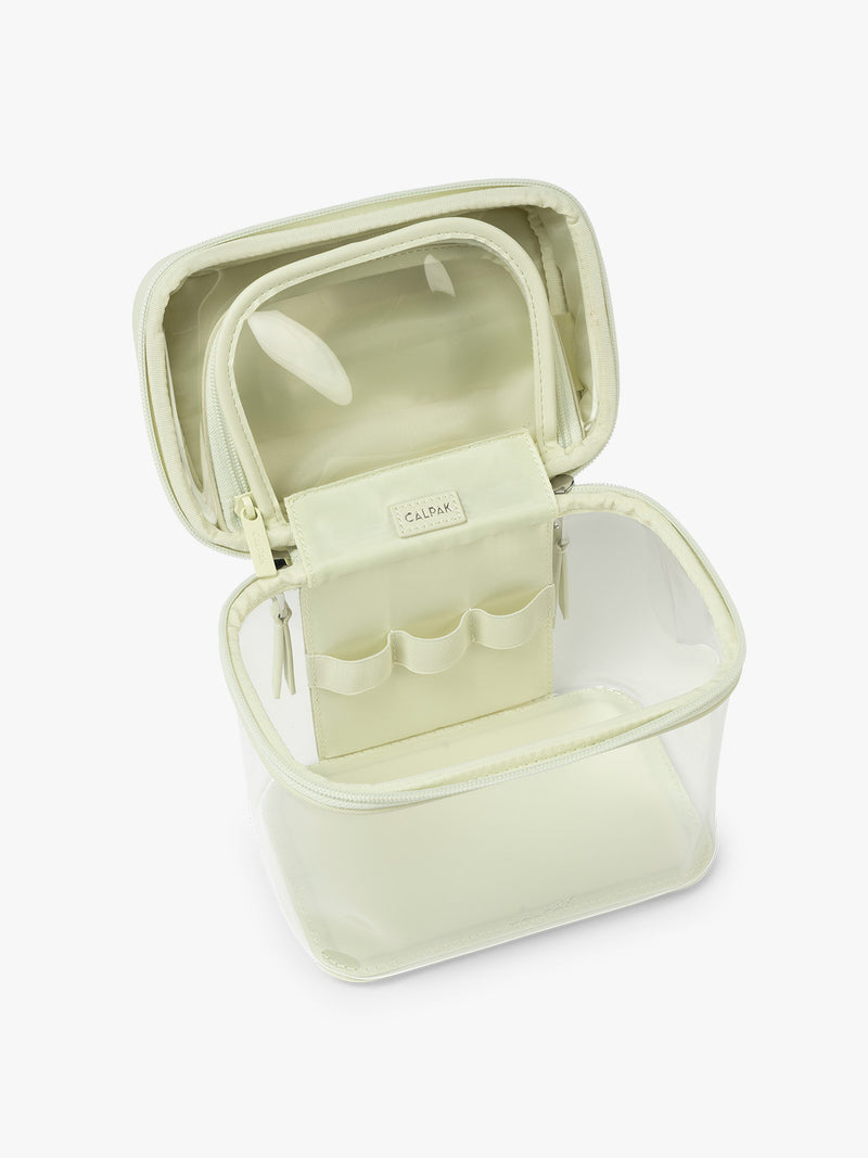 Opened view of CALPAK Clear Train Case in light green Celadon
