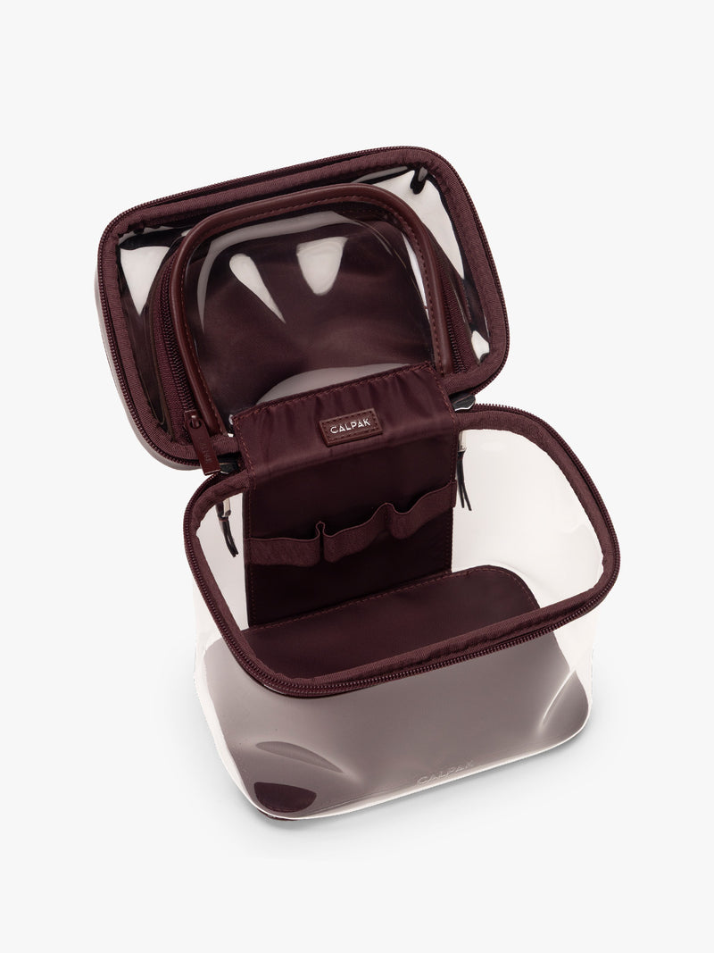 Open and empty CALPAK Clear Train Case in maroon Glazed Dark Cherry