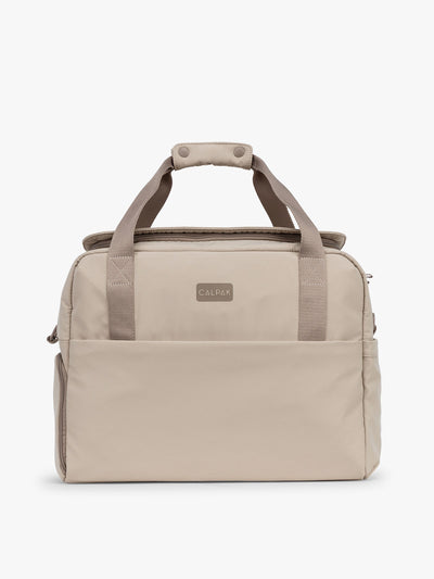 CALPAK Laptop Duffel in beige Greige front view with white background; DCN2401-GREIGE view 1