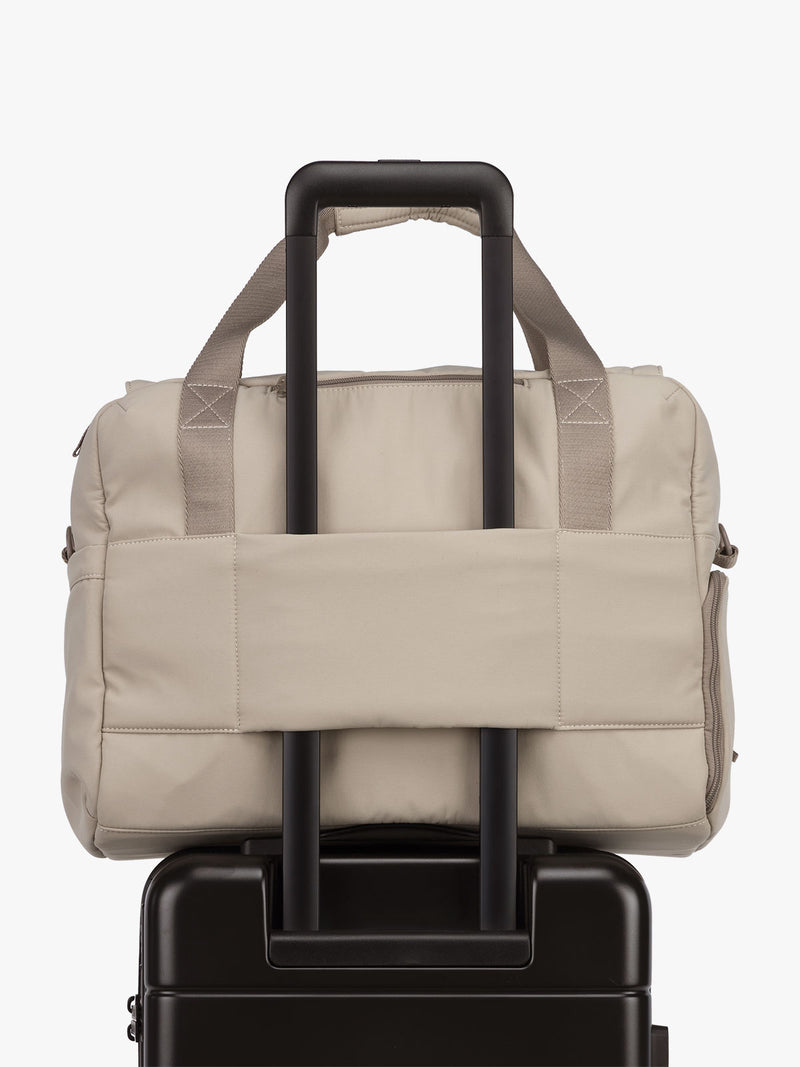 CALPAK Laptop Duffel in beige Greige luggage trolley sleeve with white background