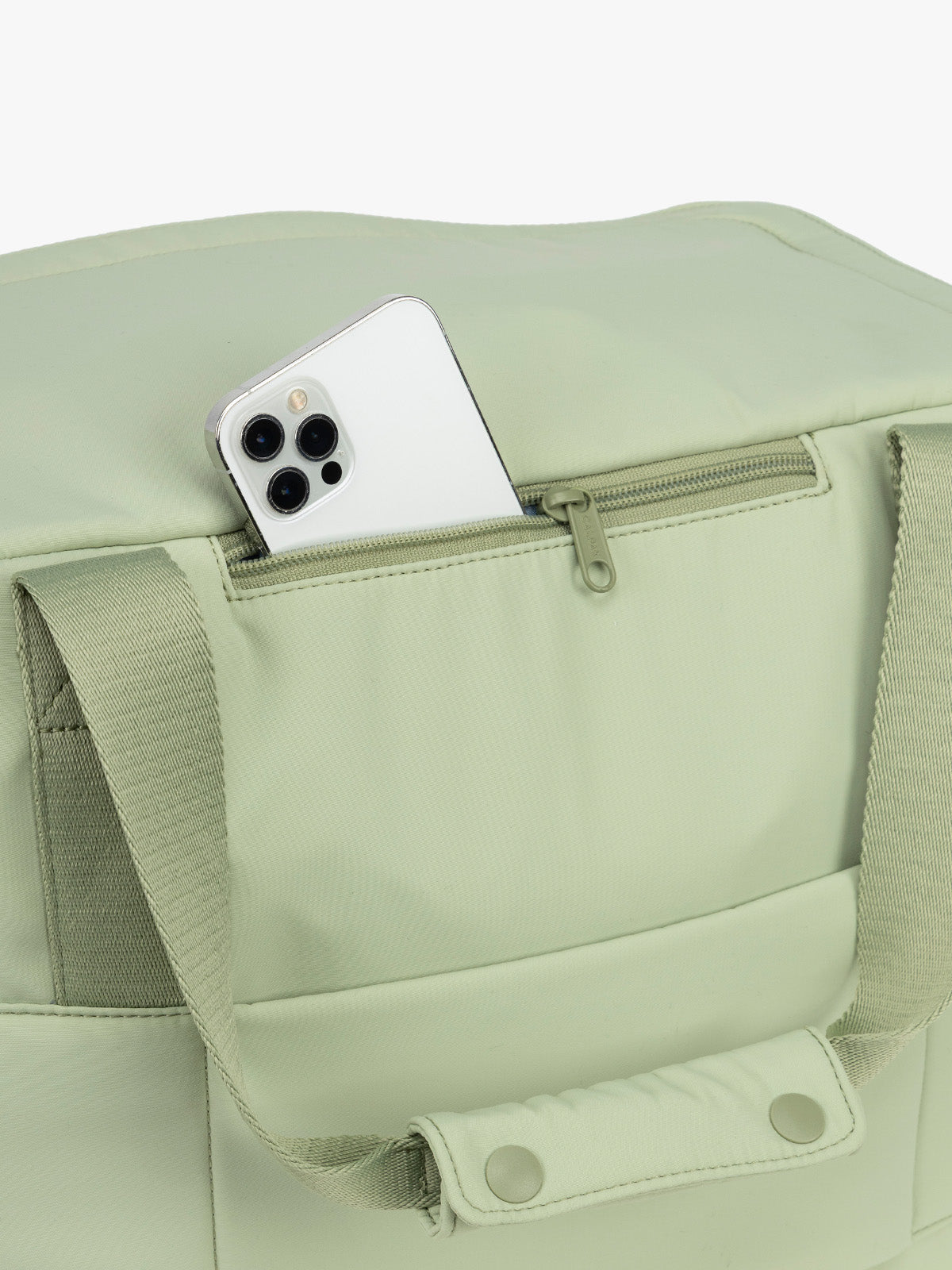 CALPAK Laptop Duffel in light green Meadow phone zipper pocket with white background; DCN2401-MEADOW