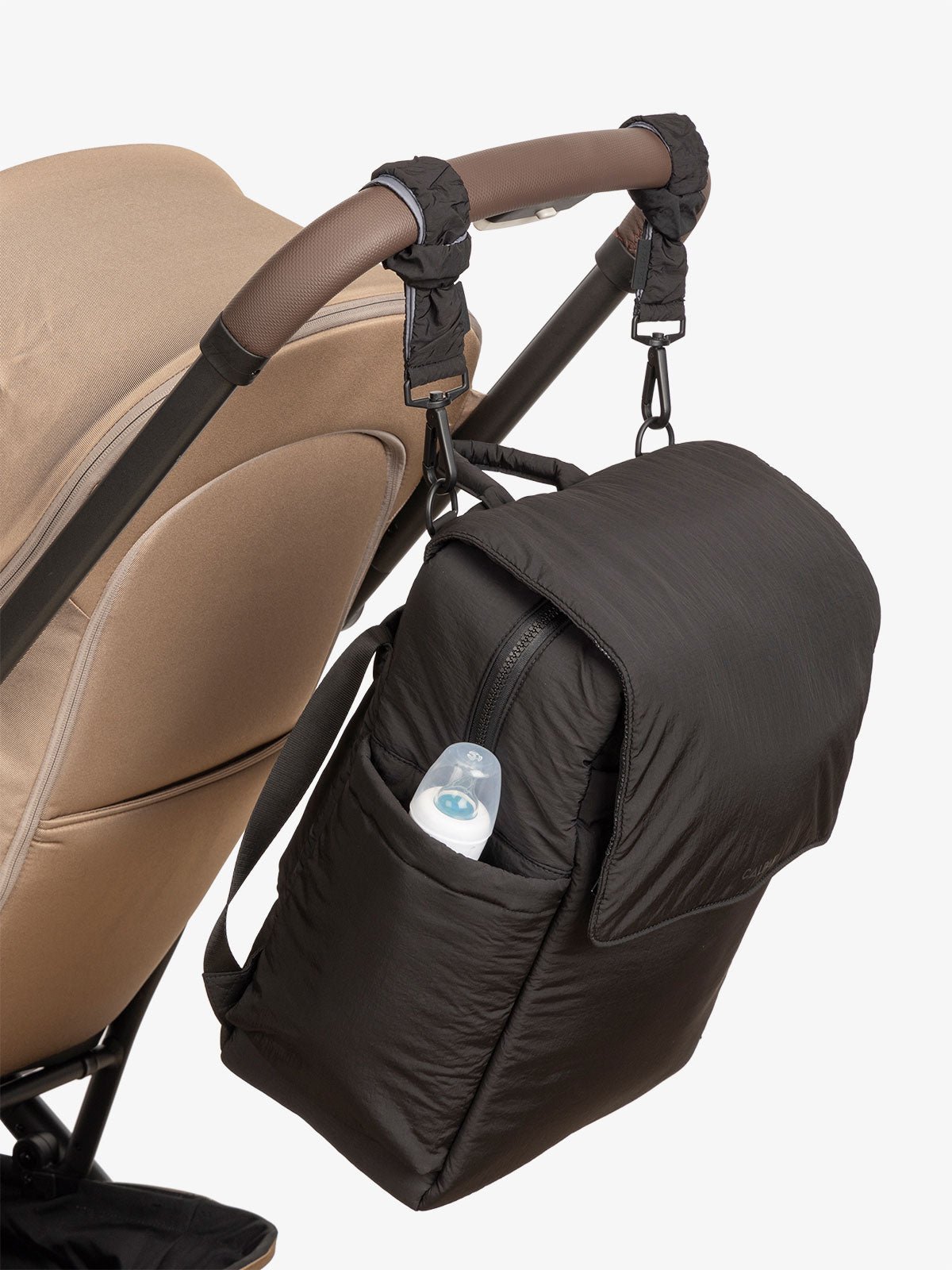 CALPAK Diaper Backpack with Laptop Sleeve attached to stroller by CALPAK Stroller Straps in black