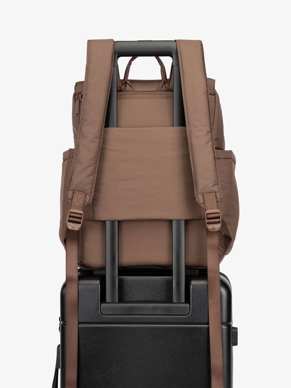 CALPAK Diaper Backpack with Laptop Sleeve featuring luggage trolley sleeve with hidden pocket in brown