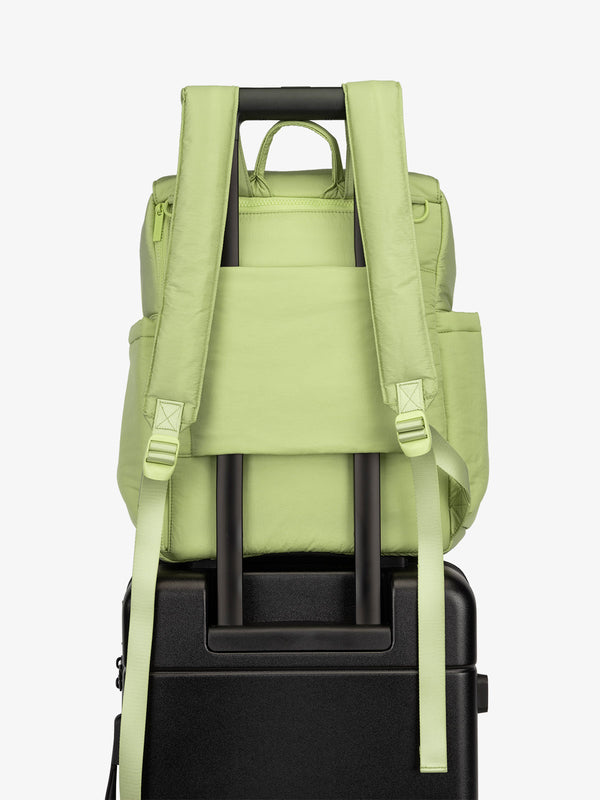 CALPAK Diaper Backpack with Laptop Sleeve featuring luggage trolley sleeve with hidden pocket in green