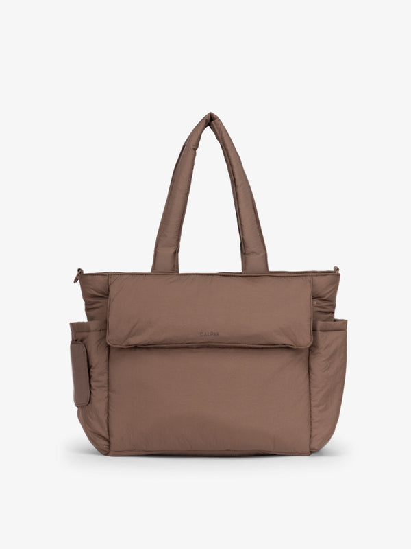 CALPAK Diaper Tote Bag with Laptop Sleeve made with durable, recycled, water-resistant material and a magnetic front pocket closure in hazelnut