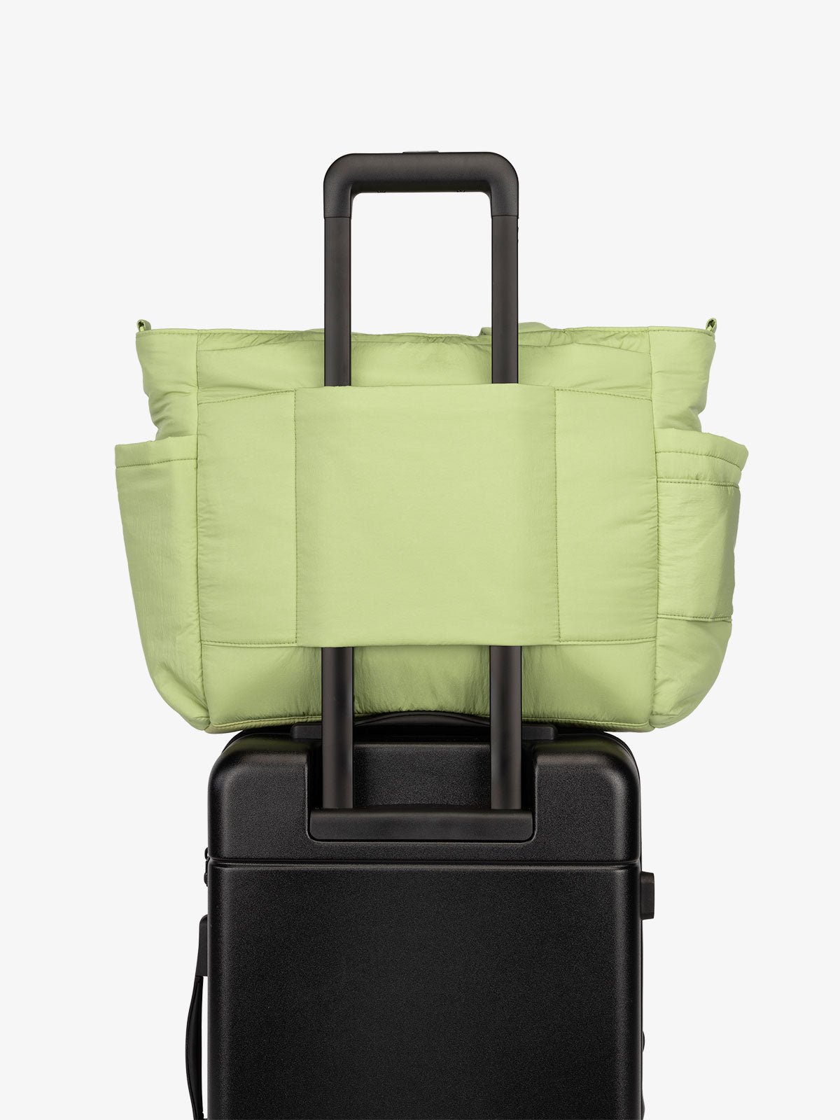 CALPAK Diaper Tote Bag with Laptop Sleeve featuring luggage trolley sleeve with back pocket in lime green